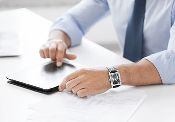 Image showing businessman with tablet pc in office