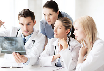 Image showing group of doctors looking at x-ray