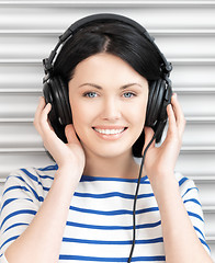 Image showing happy teenage girl in big headphones