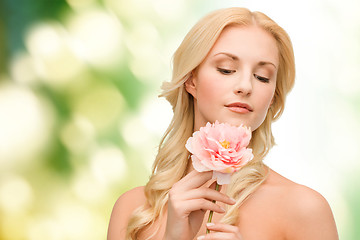 Image showing lovely woman with peony flower