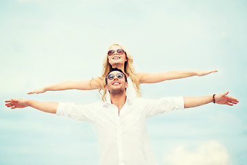 Image showing couple holding hands up at sea side