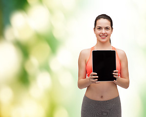 Image showing sporty woman with tablet pc blank screen