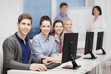 Image showing students with computer monitor at school