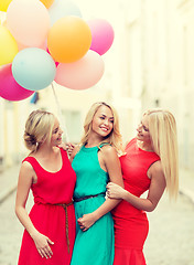 Image showing beautiful girls with colorful balloons in the city