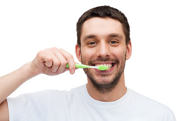 Image showing smiling young man with toothbrush