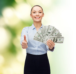 Image showing young businesswoman with dollar cash money