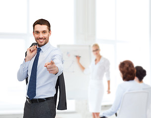 Image showing handsome buisnessman with jacket over shoulder