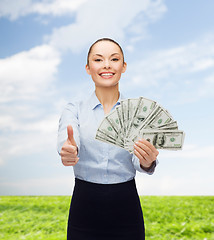 Image showing young businesswoman with dollar cash money