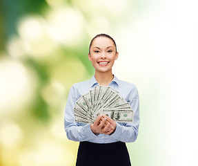 Image showing young businesswoman with dollar cash money