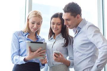 Image showing business team working with tablet pcs in office