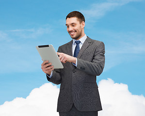 Image showing smiling businessman with tablet pc computer