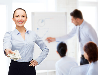 Image showing young businesswoman with dollar cash money