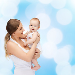 Image showing happy mother with adorable baby