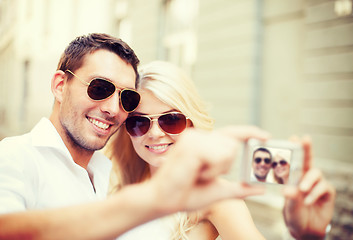 Image showing couple taking photo in cafe