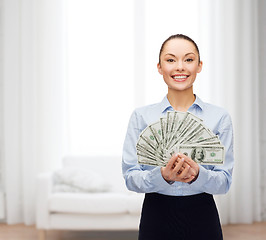 Image showing young businesswoman with dollar cash money