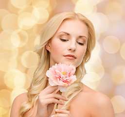 Image showing lovely woman with peony flower