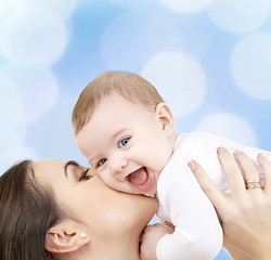 Image showing laughing baby playing with mother