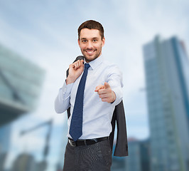 Image showing handsome buisnessman with jacket over shoulder