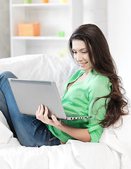 Image showing happy woman with laptop computer