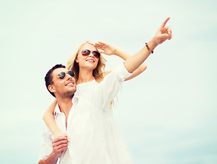 Image showing couple in shades at sea side