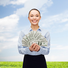 Image showing young businesswoman with dollar cash money