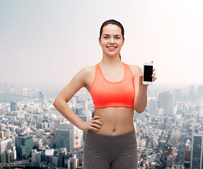 Image showing sporty woman with smartphone