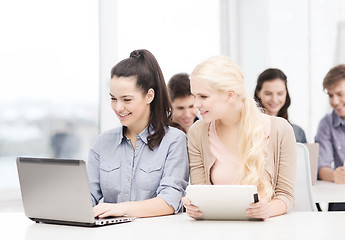 Image showing students with laptop, tablet pc and notebooks