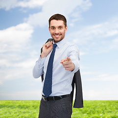 Image showing handsome buisnessman with jacket over shoulder