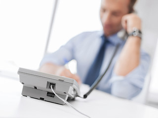 Image showing handsome businessman talking on the phone