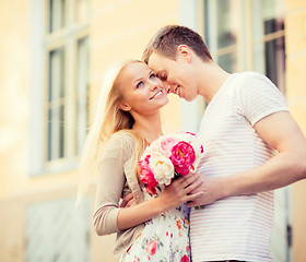 Image showing couple with flowers in the city