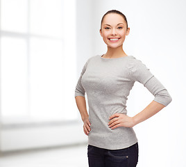 Image showing smiling asian woman over white background