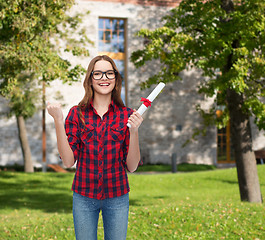 Image showing smiling female student in eyeglasses with diploma