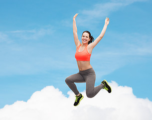 Image showing sporty teenage girl jumping in sportswear