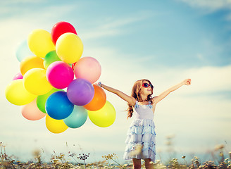 Image showing happy girl with colorful balloons