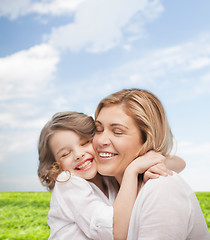 Image showing happy mother and daughter hugging