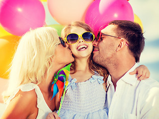 Image showing family with colorful balloons