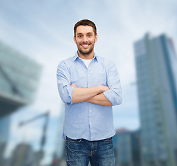 Image showing smiling man with crossed arms