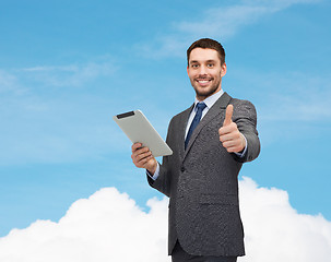 Image showing smiling businessman with tablet pc computer