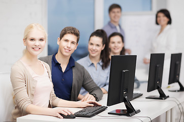 Image showing students with computer monitor at school