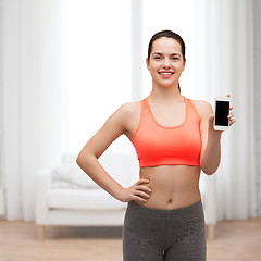 Image showing sporty woman with smartphone