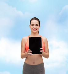 Image showing sporty woman with tablet pc blank screen