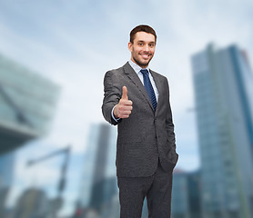 Image showing handsome buisnessman showing thumbs up