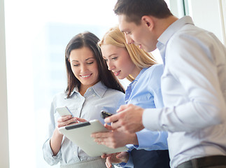 Image showing business team working with tablet pcs in office