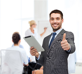 Image showing smiling buisnessman with tablet pc computer