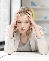 Image showing unhappy woman in office