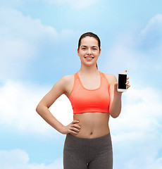 Image showing sporty woman with smartphone