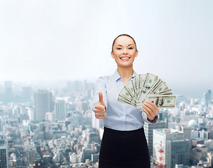 Image showing young businesswoman with dollar cash money