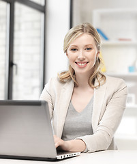 Image showing happy woman with laptop computer