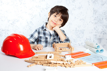 Image showing boy plans to build a house