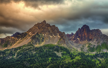 Image showing Cloudy Sunset Over the Peaks